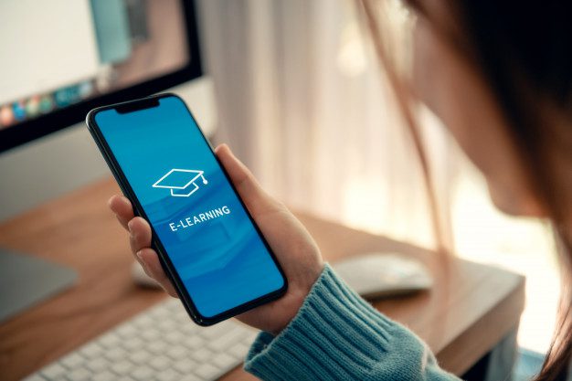 online education e learning young woman using mobile phone with inscription screen e learning image square academic cap distance training 52701 209