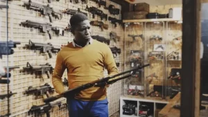 Man shopping for rifle made easy from firearm retailers holiday prep.