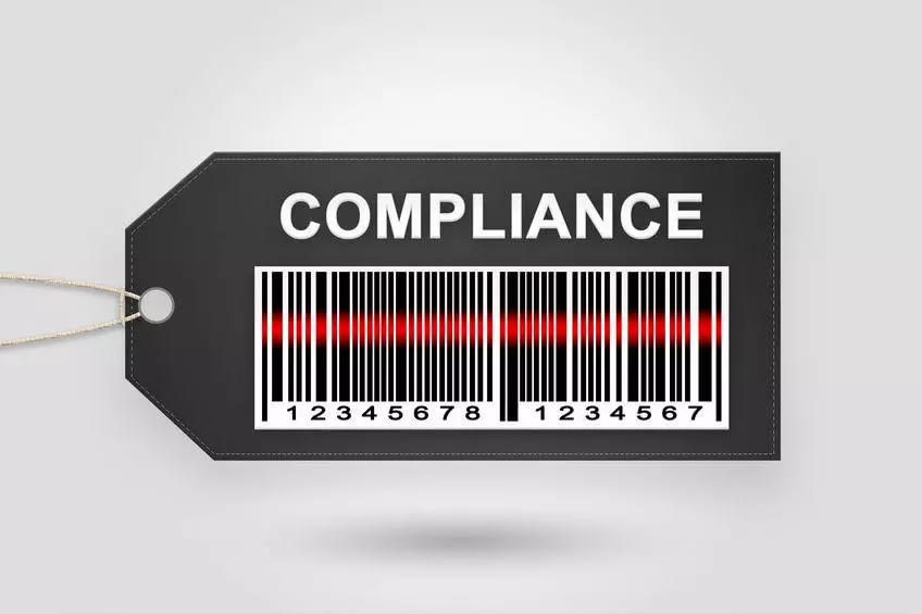 A black compliance tag with barcode and red laser scan, hangs on string, representing secure e4473 software for gun dealers.